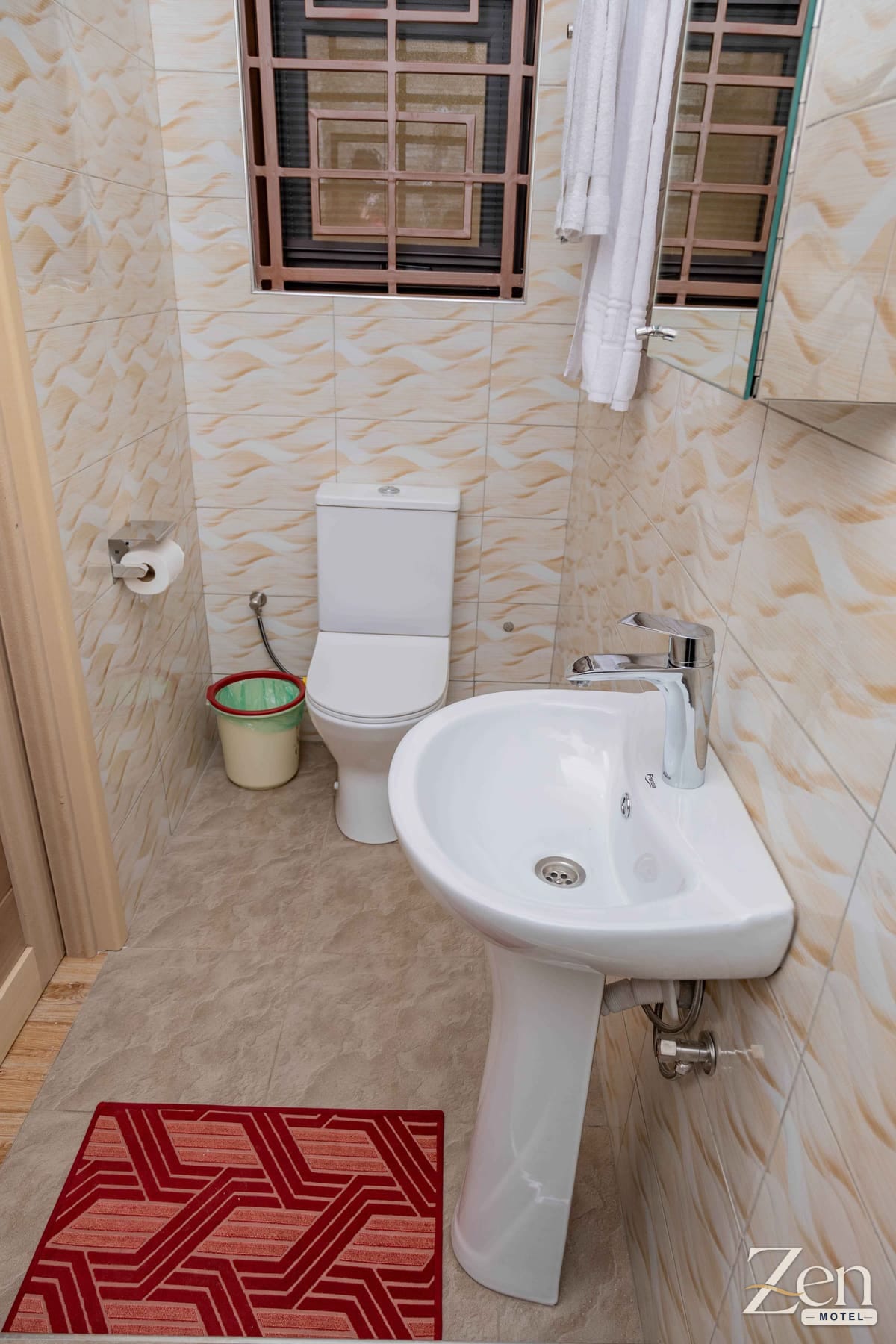 Private bathroom with basin, WC and frosted window